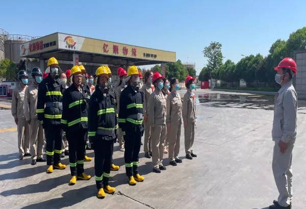 Chemical plant staff and emergency responders taking part in a safety drill